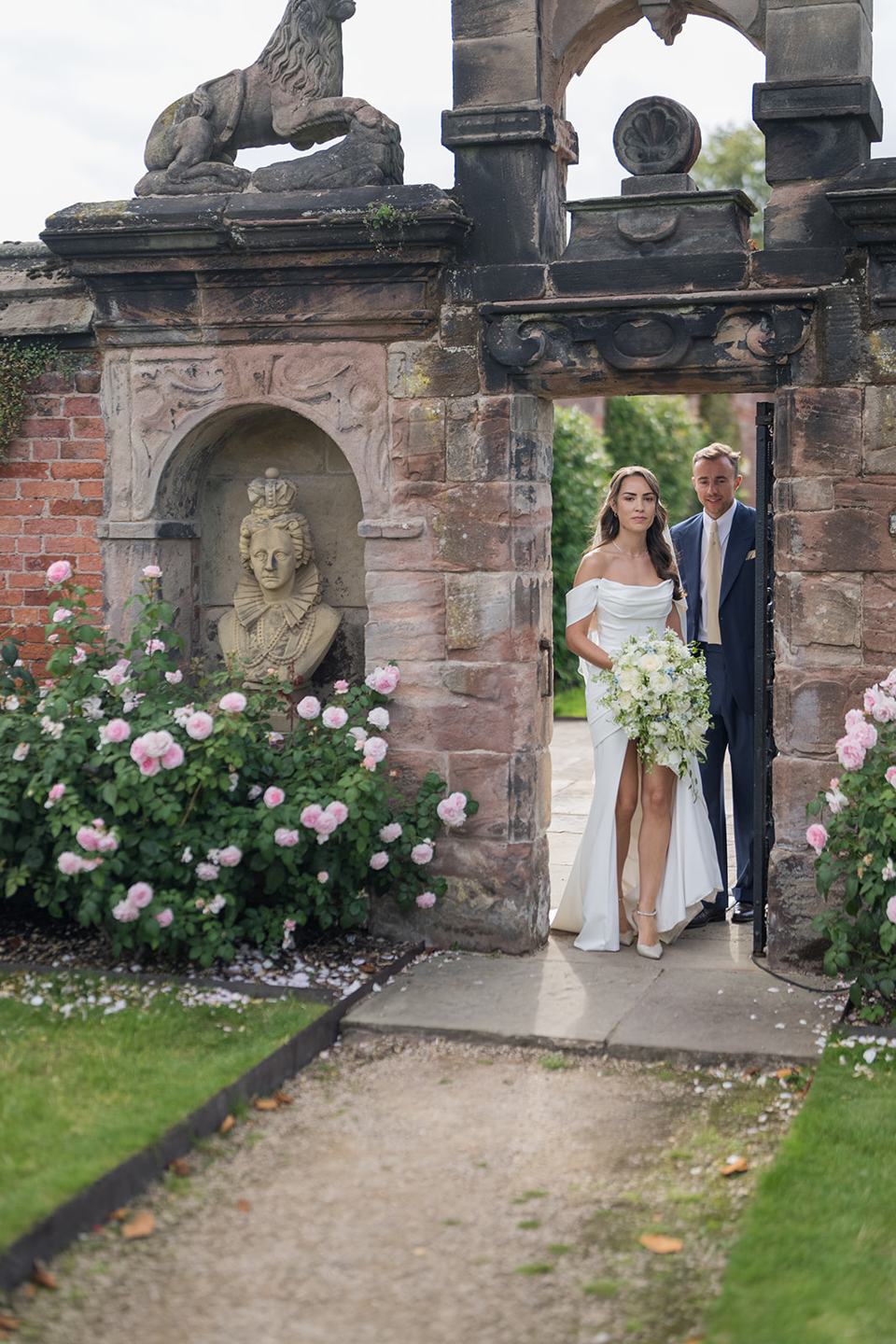 Garden gateway portrait at Lizzie and Jack’s Dorfold Hall wedding
