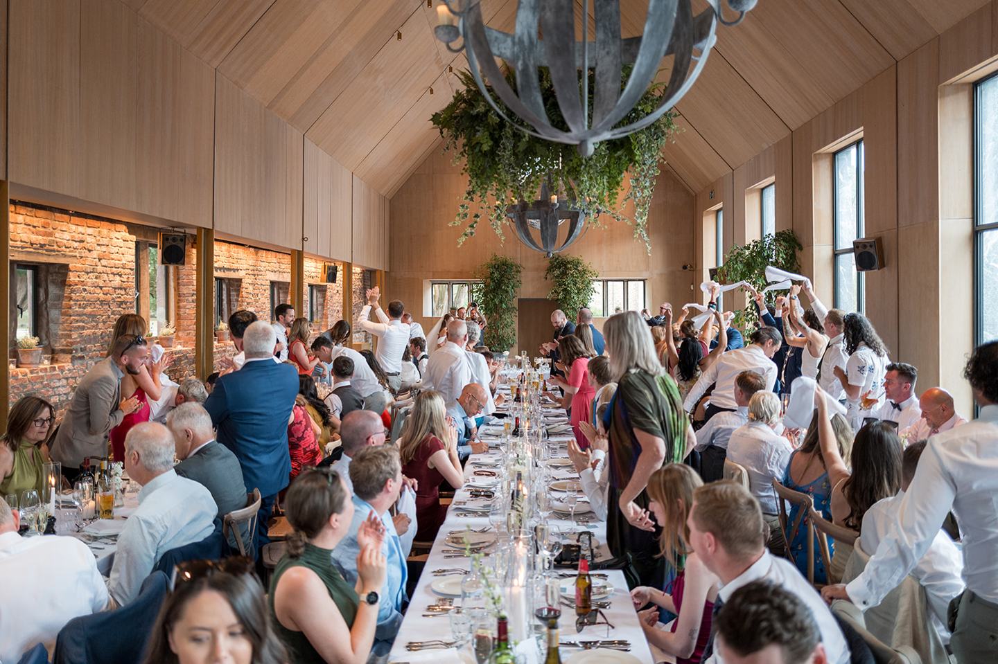 Guests at the wedding breakfast at Lizzie and Jack’s Dorfold Hall wedding
