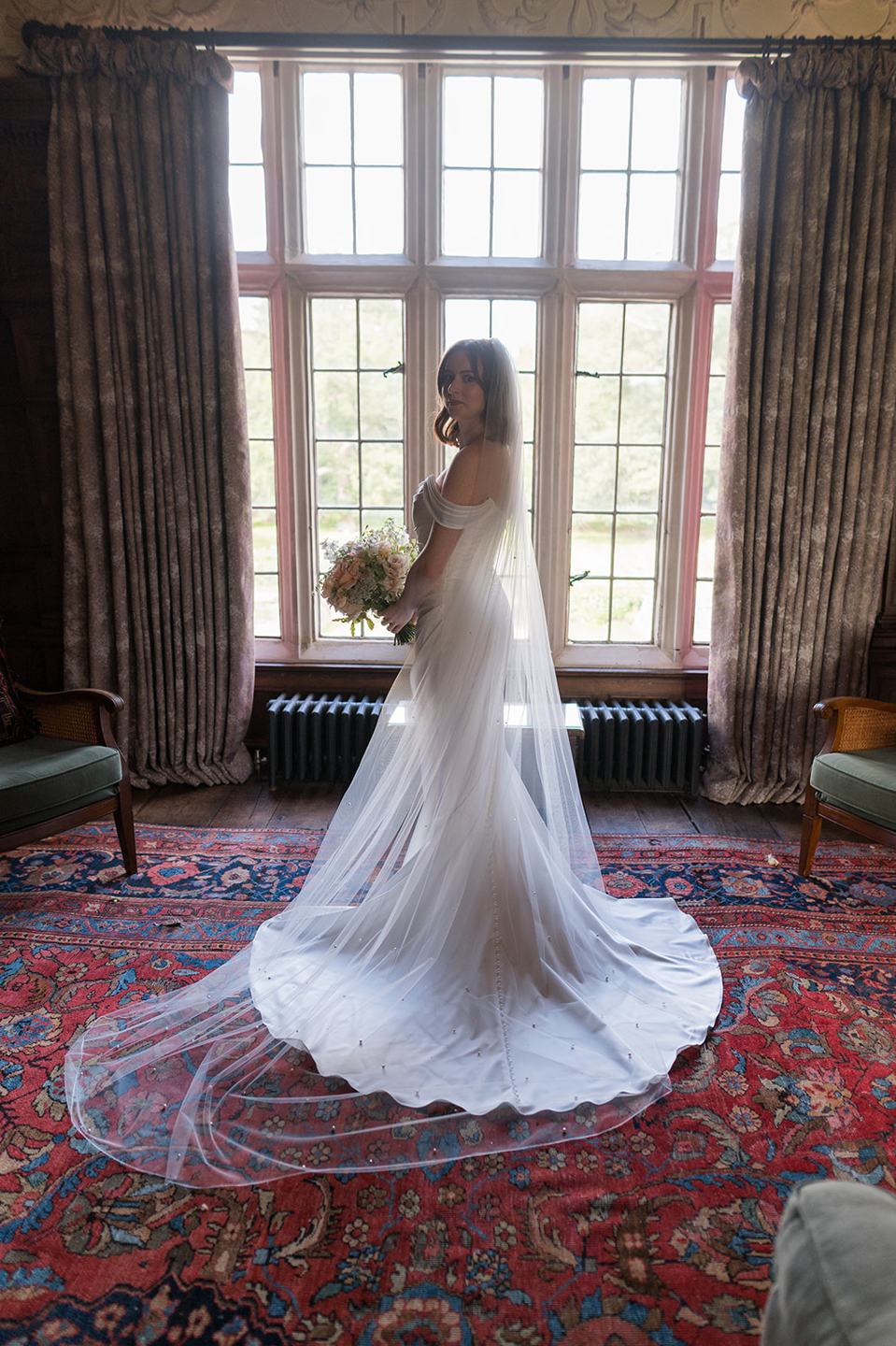 Window-light bridal portrait at Louise and Ben’s Dorfold Hall wedding