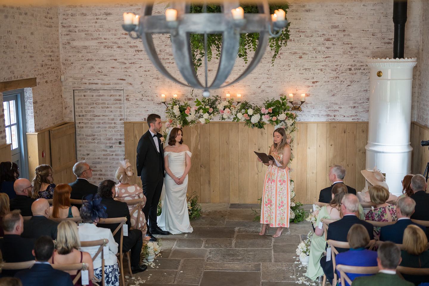 Guests watching the ceremony at Louise and Ben’s Dorfold Hall wedding