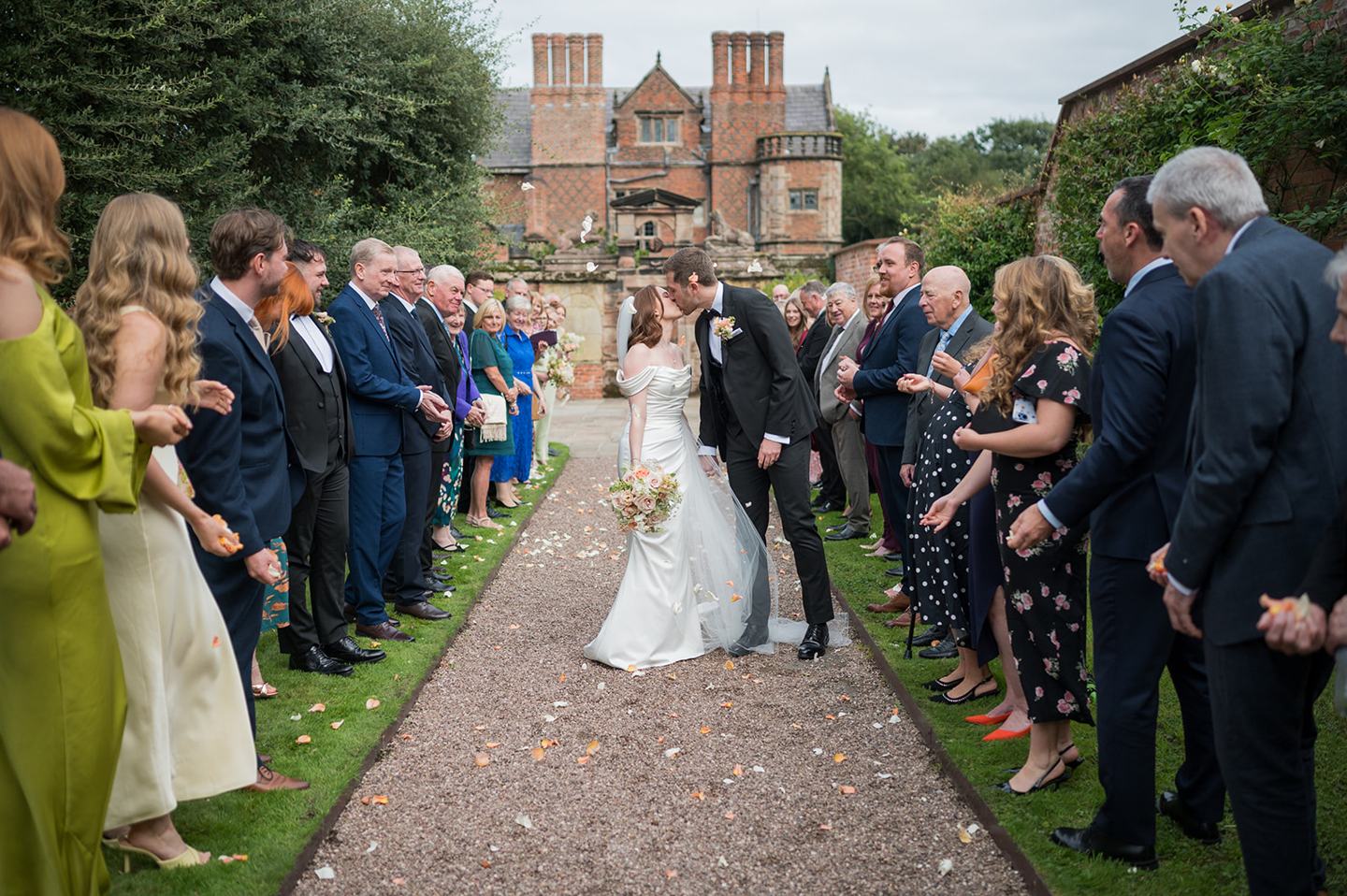 Confetti on the lawn at Louise and Ben’s Dorfold Hall wedding