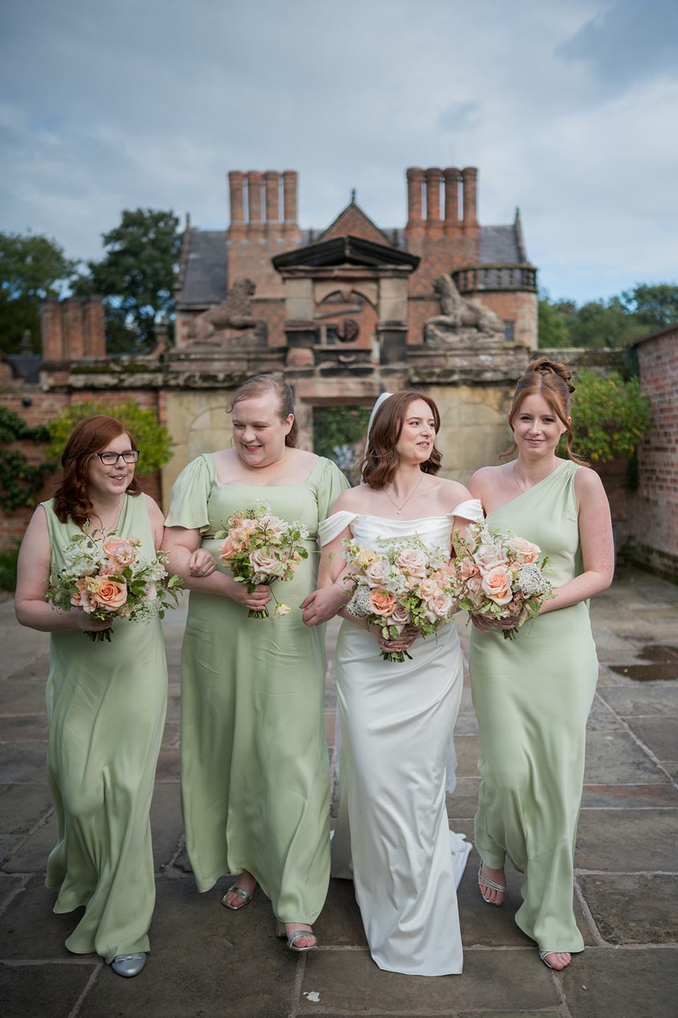 Bridesmaids in the gardens at Louise and Ben’s Dorfold Hall wedding