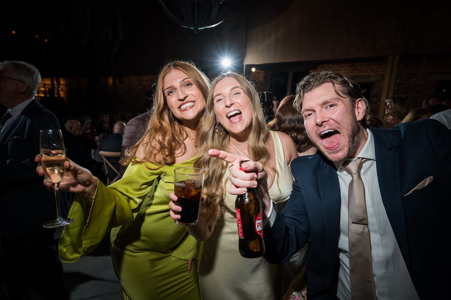 Friends celebrating at Louise and Ben’s Dorfold Hall wedding