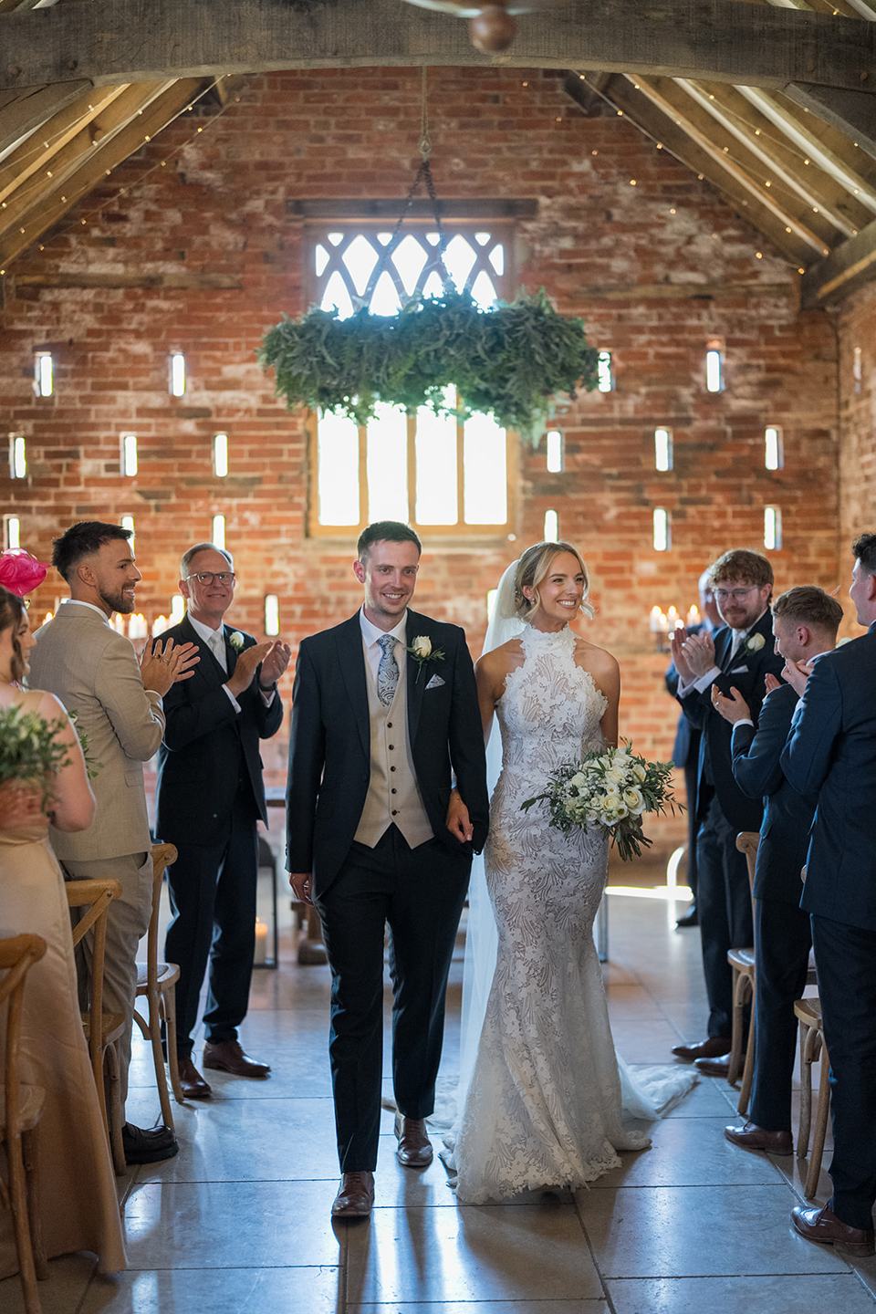 Walking down the aisle together at Emma and Jack’s Grangefields wedding