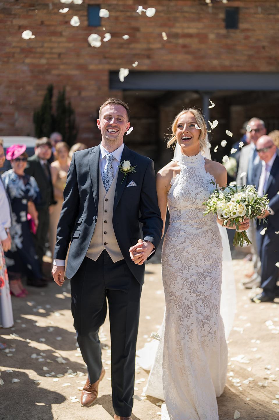 Confetti outside the barn at Emma and Jack’s Grangefields wedding