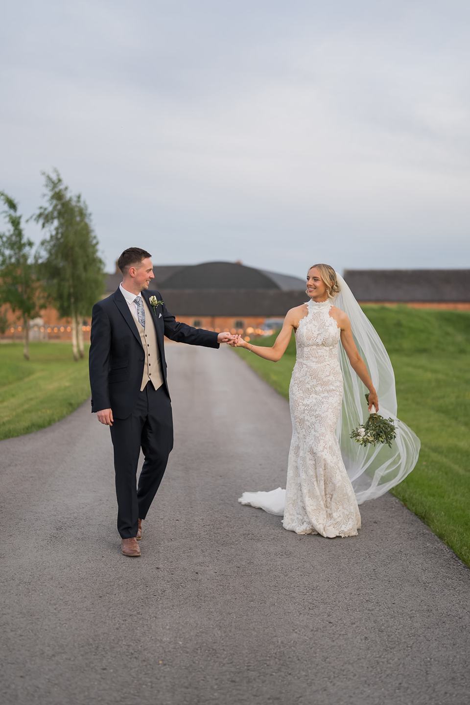 Walking through the grounds at Emma and Jack’s Grangefields wedding