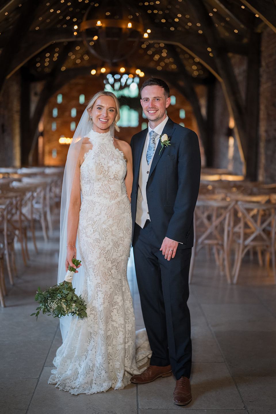 Portrait beneath the timber beams at Emma and Jack’s Grangefields wedding
