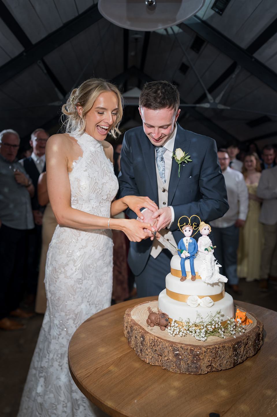 Cutting the cake at Emma and Jack’s Grangefields wedding
