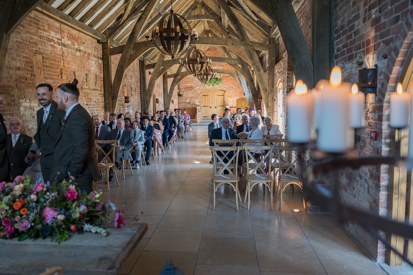 Guests gathered in the ceremony barn at Georgie and Matt’s Grangefields wedding