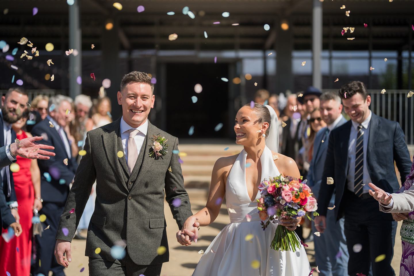 Confetti outside the reception building at Georgie and Matt’s Grangefields wedding
