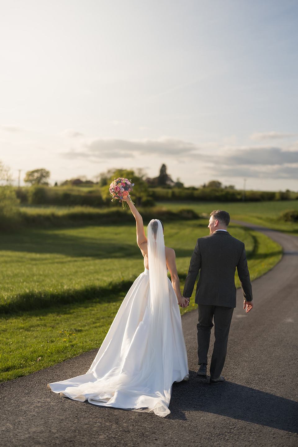 Newlyweds in the countryside at Georgie and Matt’s Grangefields wedding