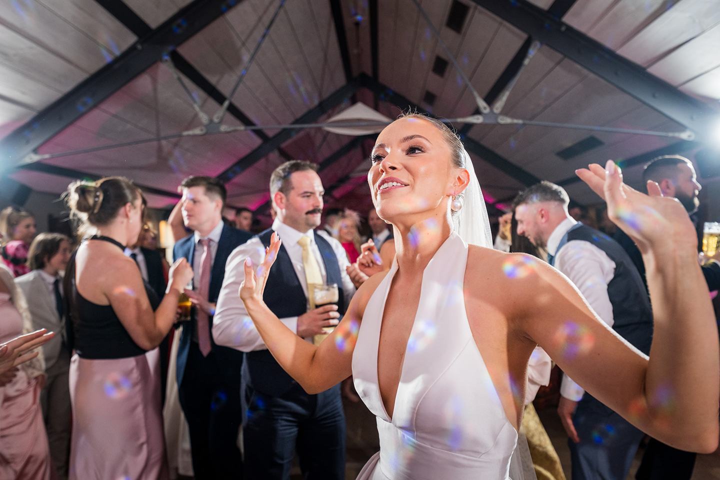 Bride celebrating with guests at Georgie and Matt’s Grangefields wedding