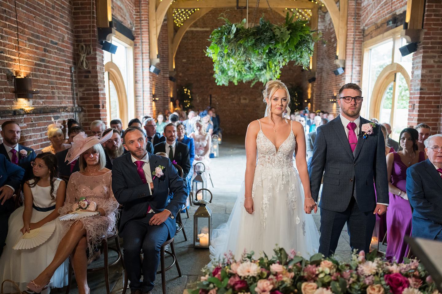 The ceremony in the barn at Chloe and Wilson’s Hazel Gap Barn wedding