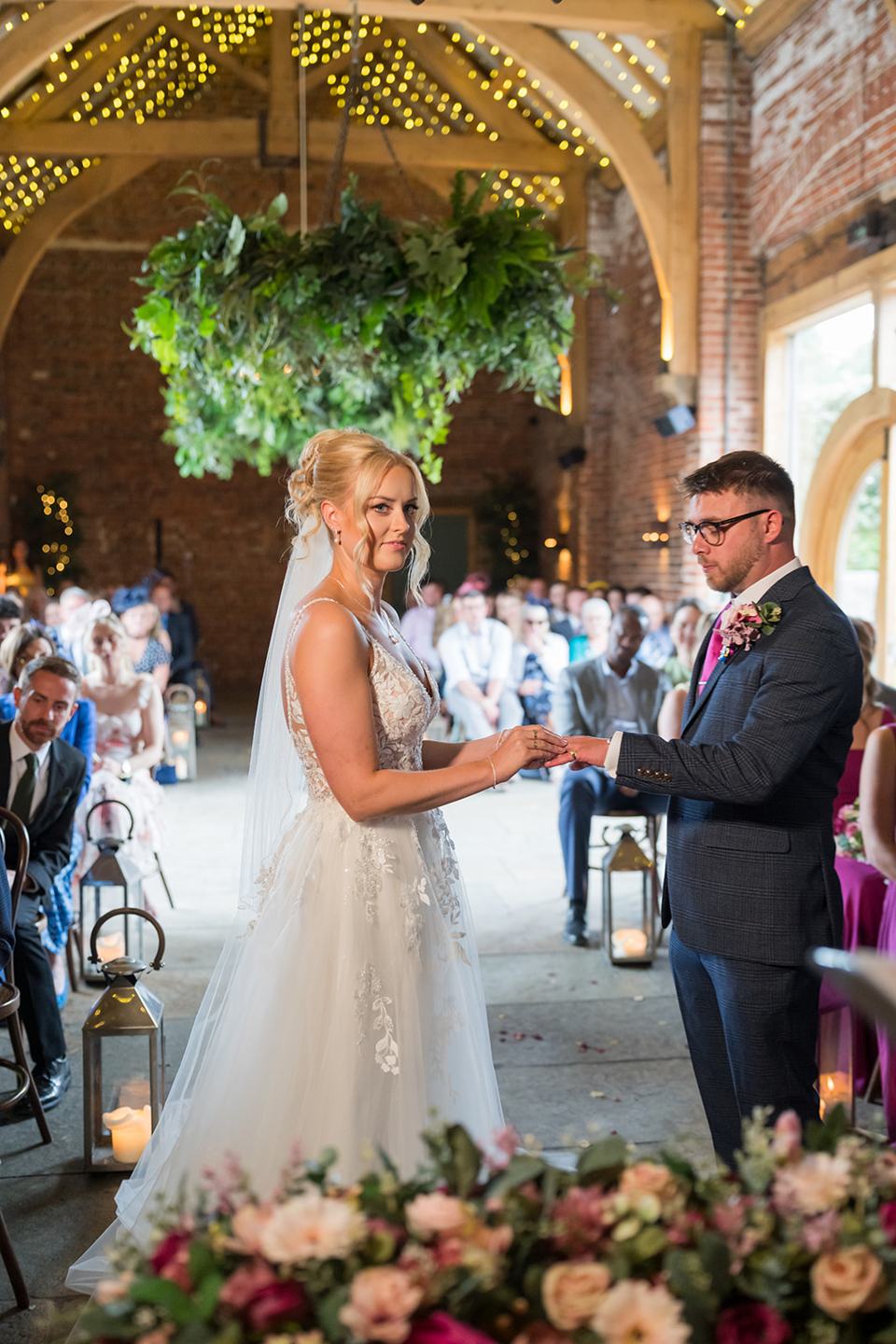 Exchanging rings at Chloe and Wilson’s Hazel Gap Barn wedding
