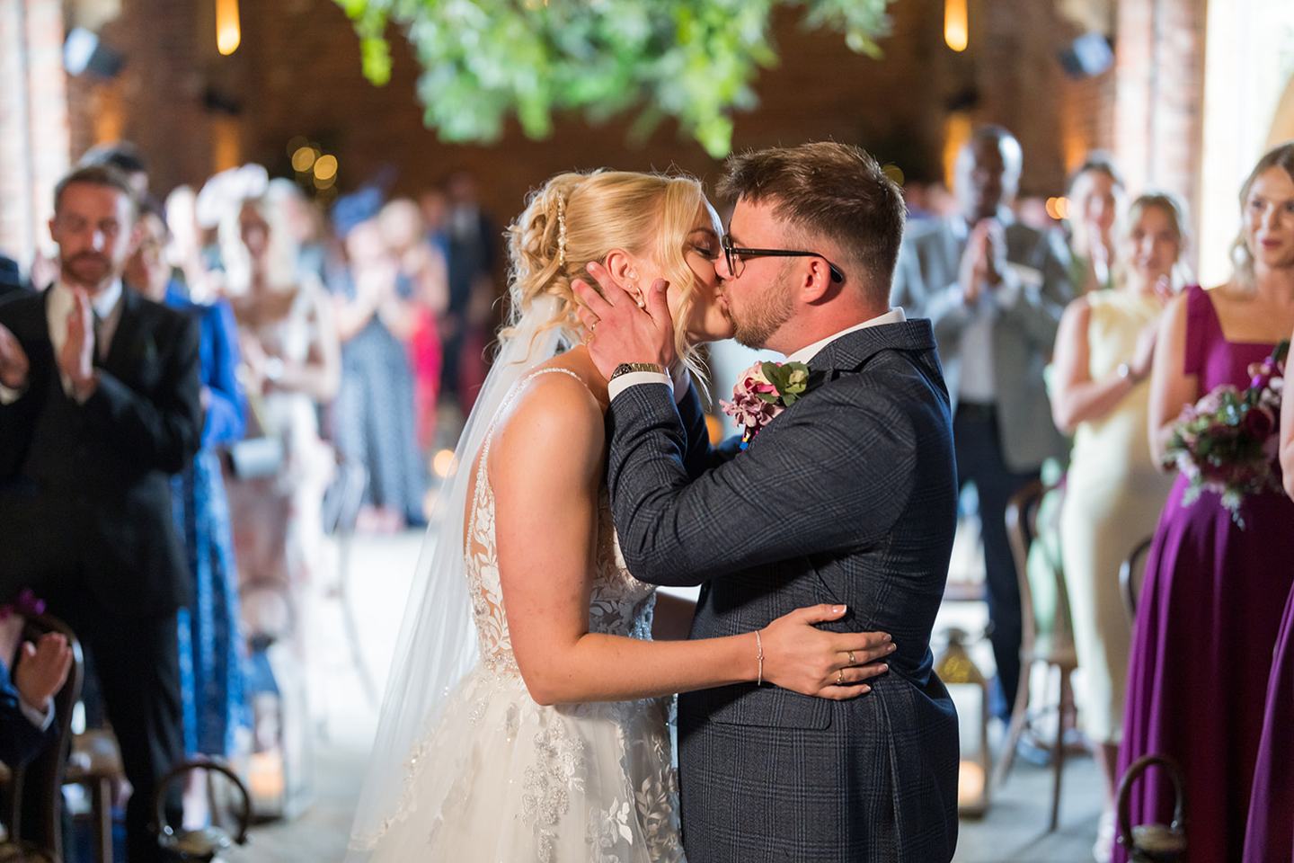 The first kiss at Chloe and Wilson’s Hazel Gap Barn wedding