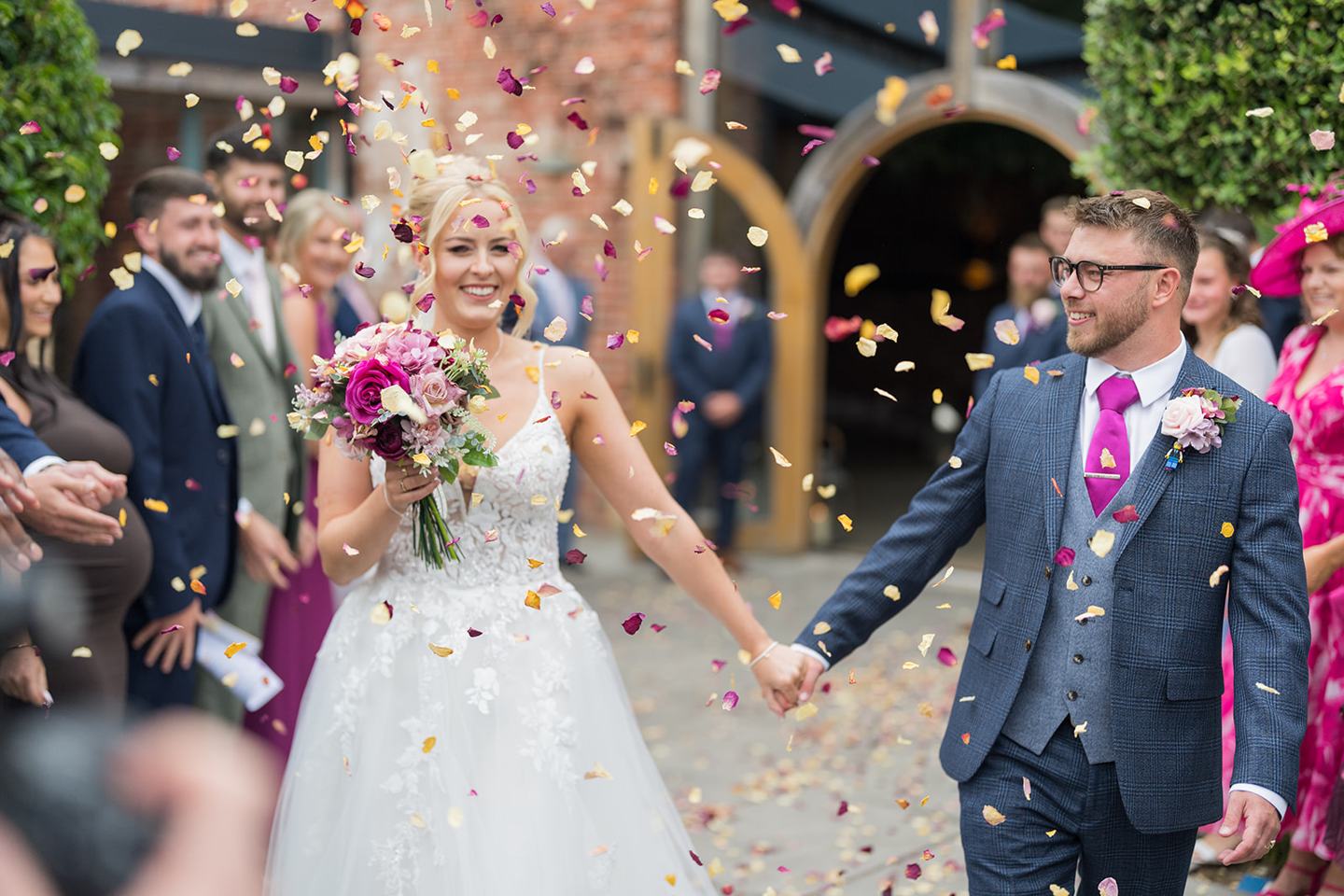 Confetti outside the barn at Chloe and Wilson’s Hazel Gap Barn wedding