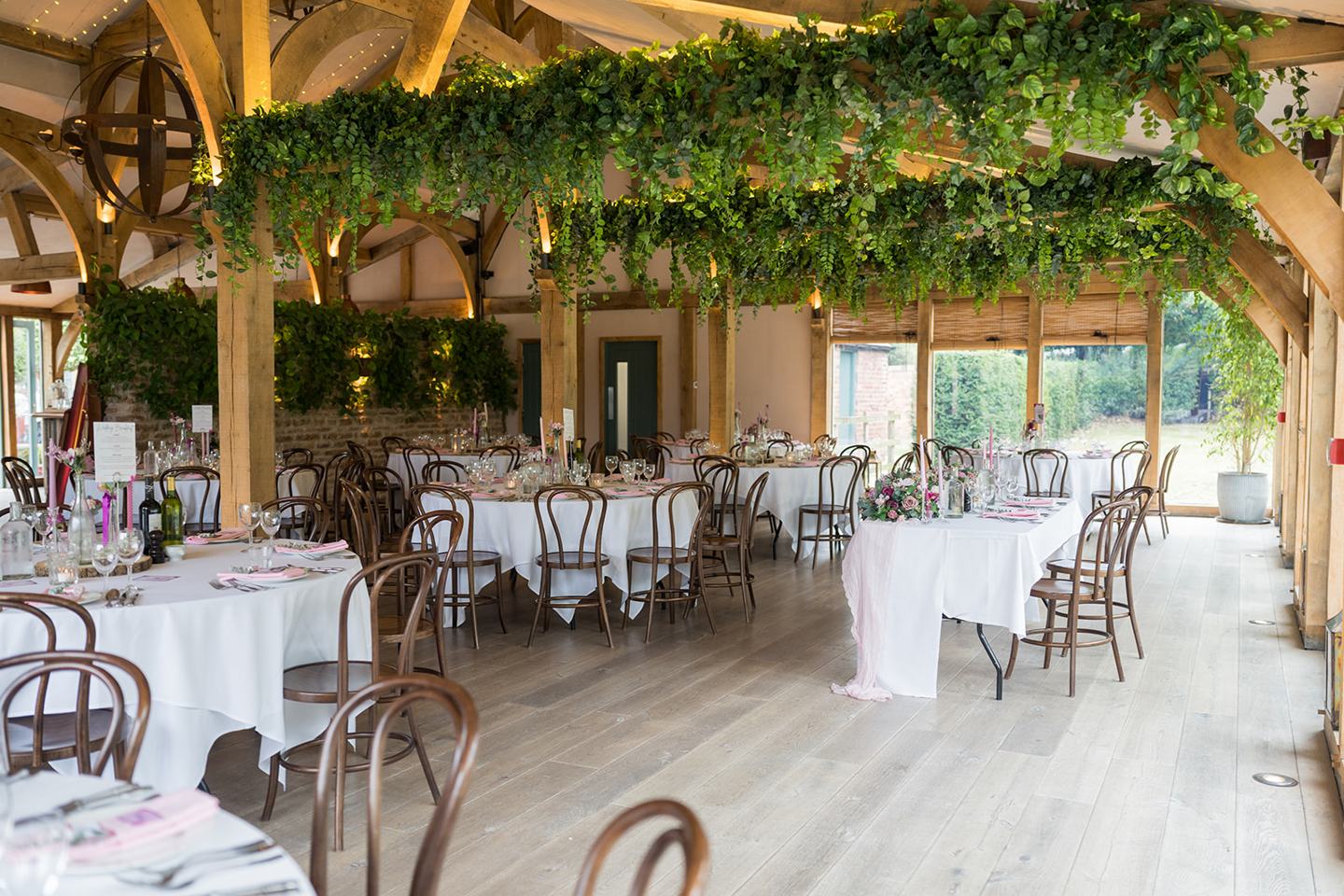Wedding breakfast tables at Chloe and Wilson’s Hazel Gap Barn wedding