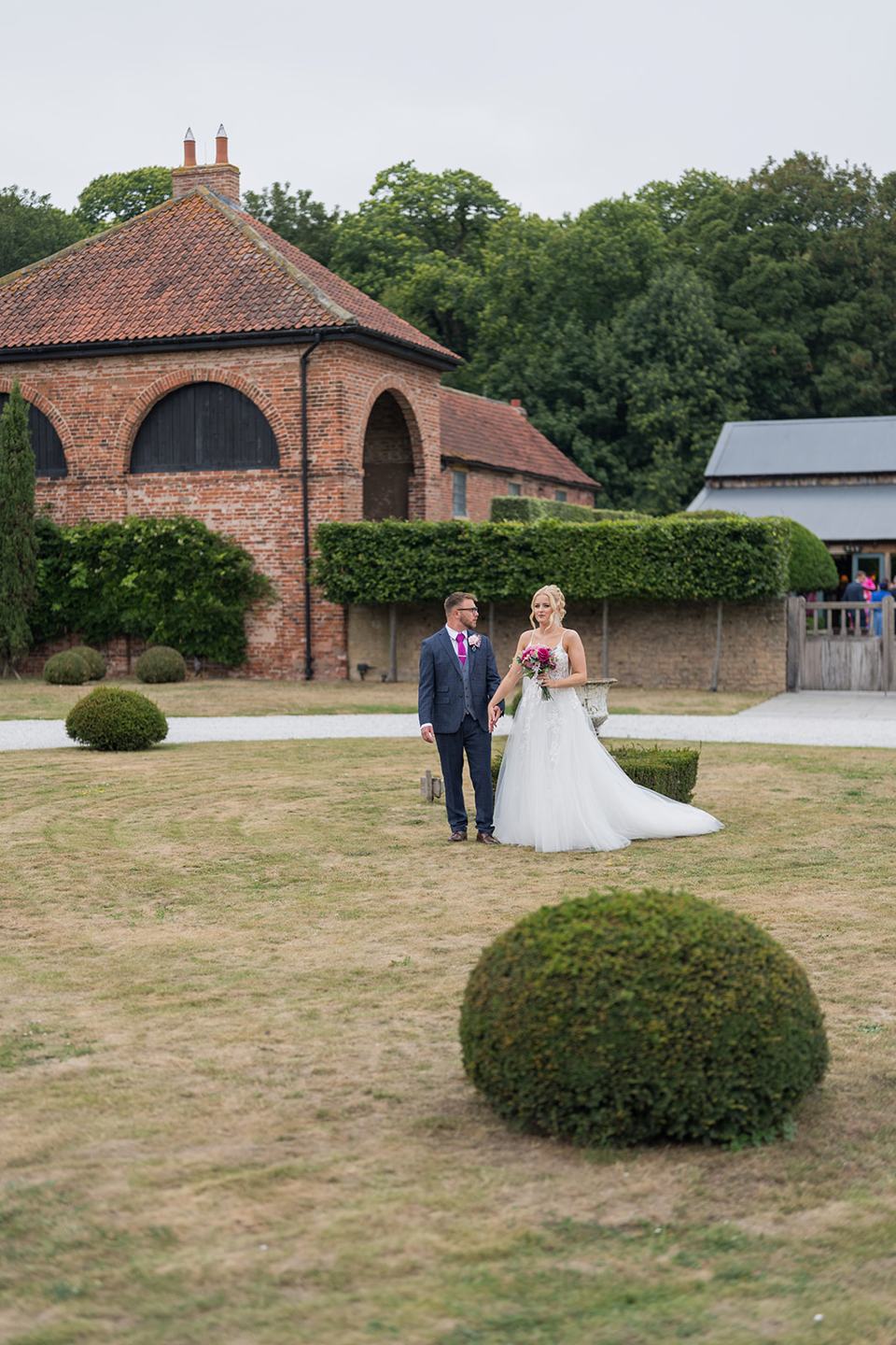 Portrait in the courtyard at Chloe and Wilson’s Hazel Gap Barn wedding