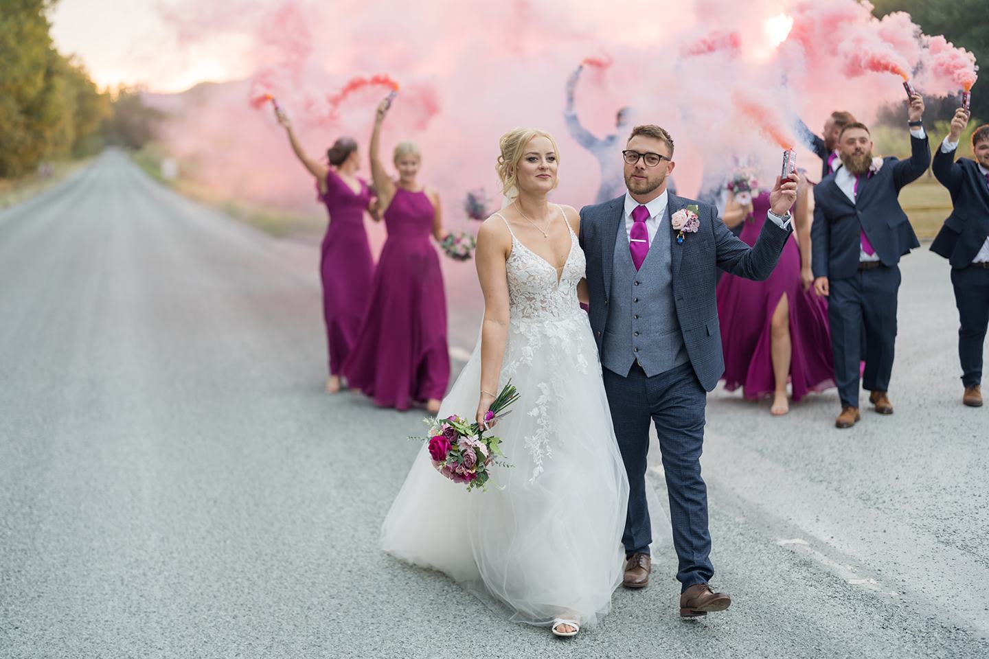 Wedding party with coloured smoke at Chloe and Wilson’s Hazel Gap Barn wedding