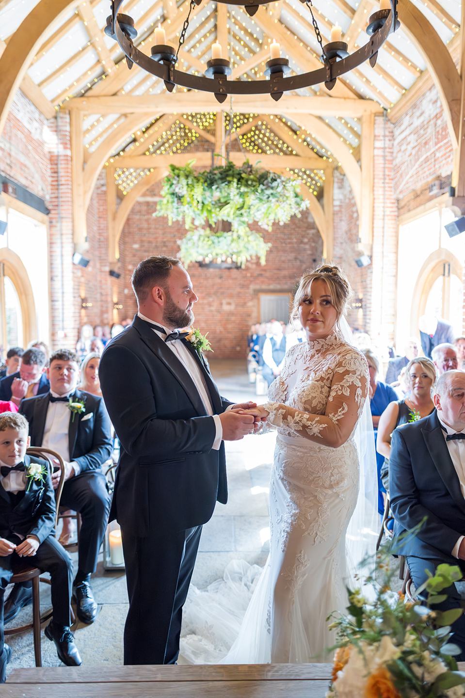 Exchanging rings at Emma and Sam’s Hazel Gap Barn wedding