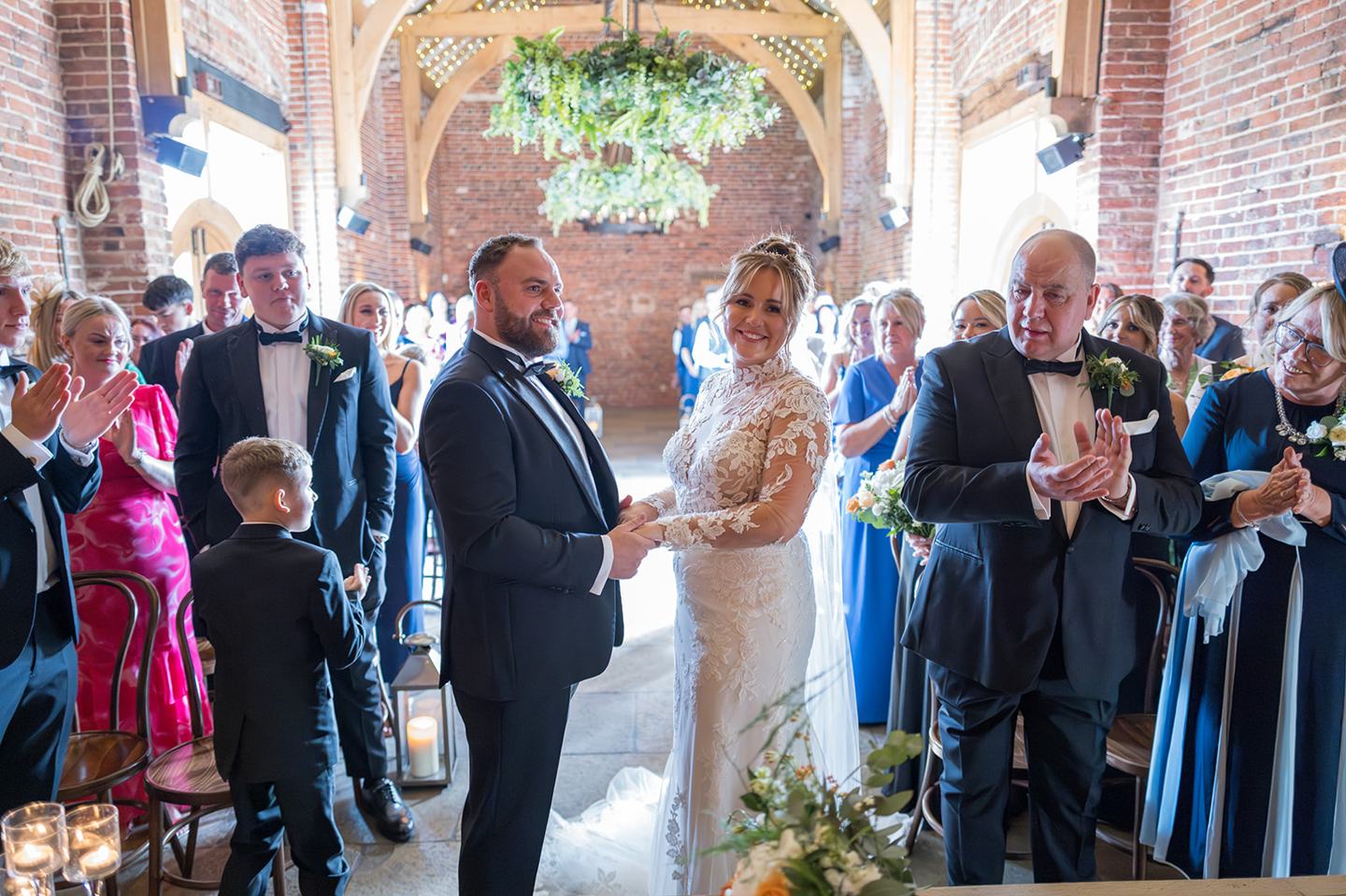 The first kiss at Emma and Sam’s Hazel Gap Barn wedding