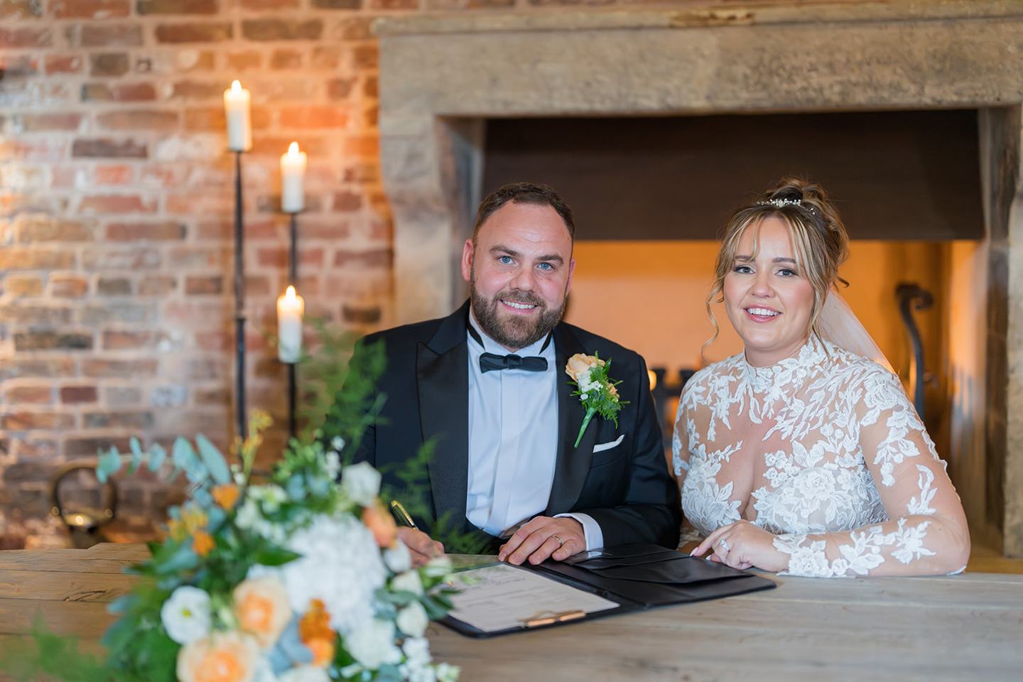 Signing the register at Emma and Sam’s Hazel Gap Barn wedding