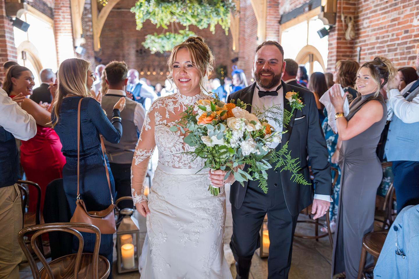 Walking out together at Emma and Sam’s Hazel Gap Barn wedding