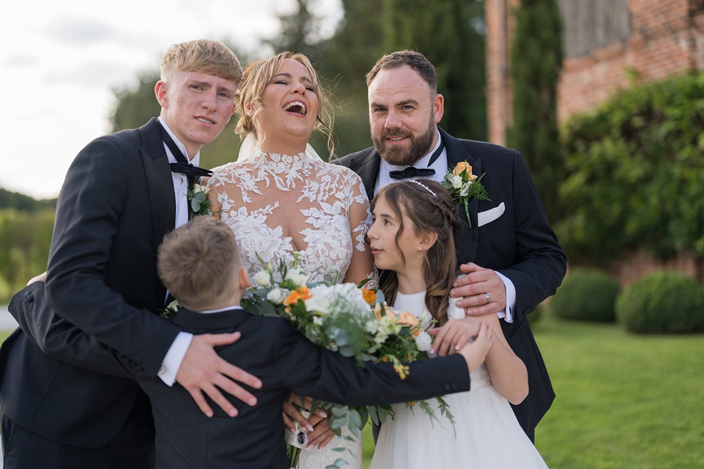 A family moment in the grounds at Emma and Sam’s Hazel Gap Barn wedding