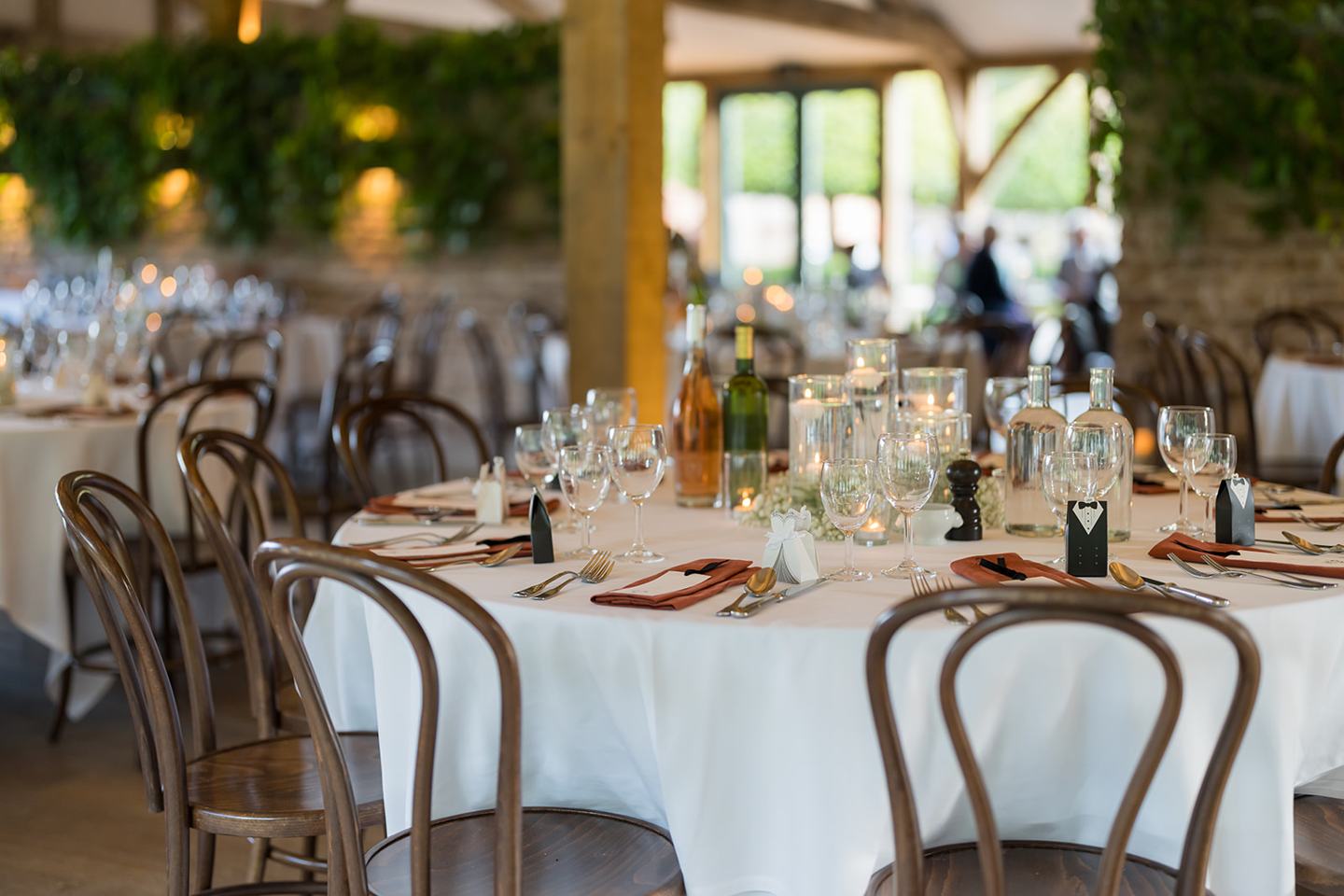 Wedding breakfast tables at Emma and Sam’s Hazel Gap Barn wedding