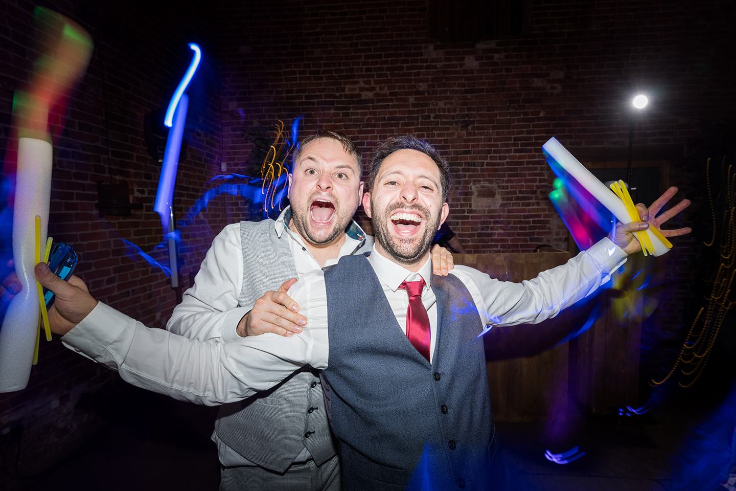 Friends on the dance floor at Emma and Sam’s Hazel Gap Barn wedding