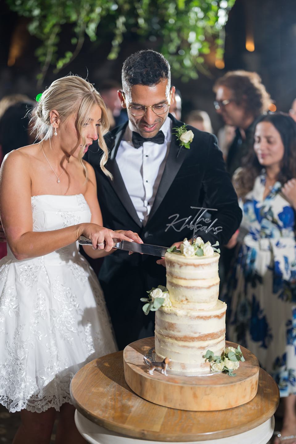 Cutting the wedding cake at Mia and Herman’s Healey Barn wedding
