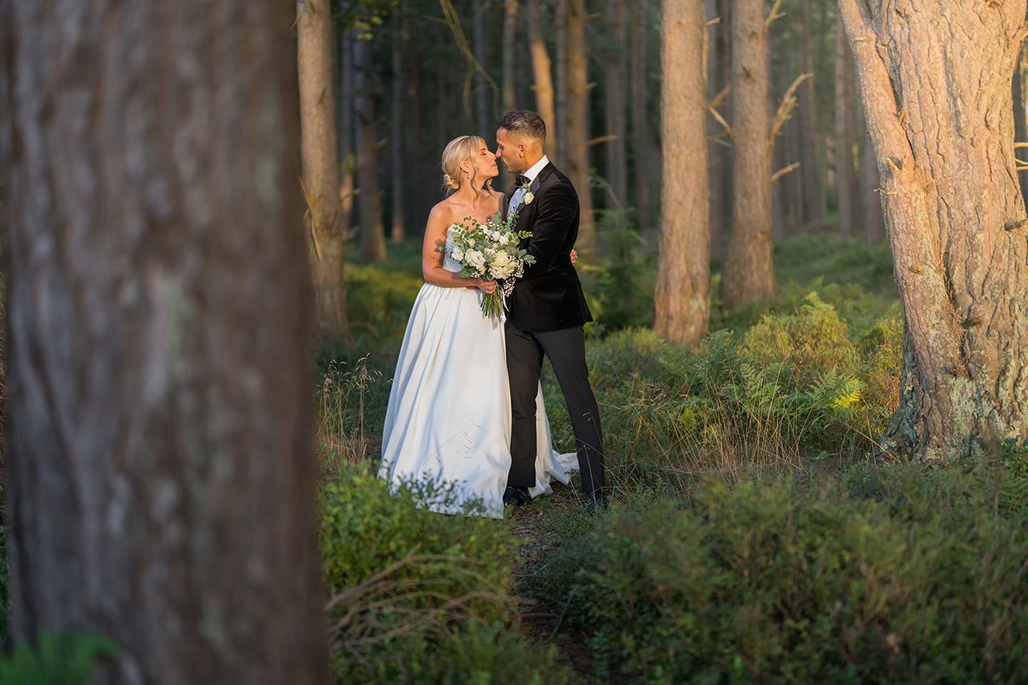 Portrait among the woodland trees at Mia and Herman’s Healey Barn wedding