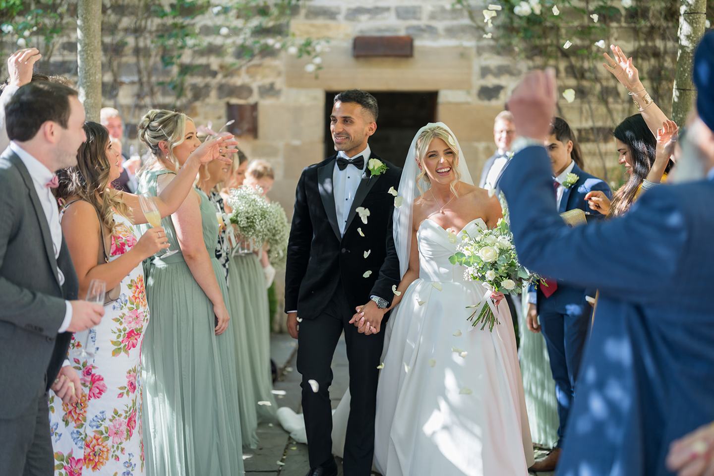 Confetti outside the barn at Mia and Herman’s Healey Barn wedding
