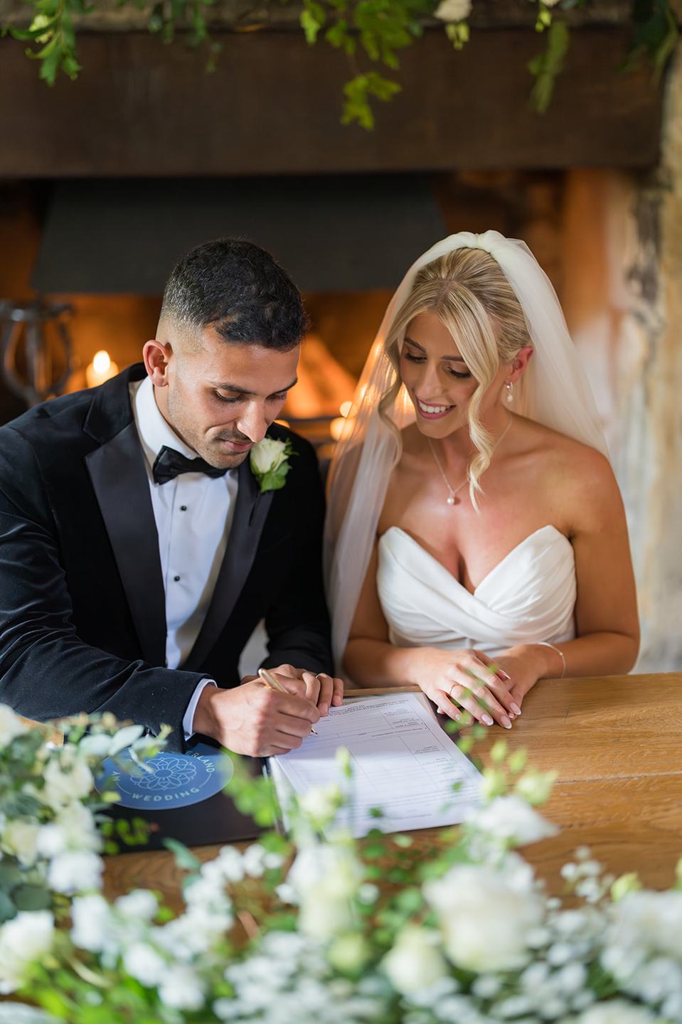 Signing the marriage register at Mia and Herman’s Healey Barn wedding