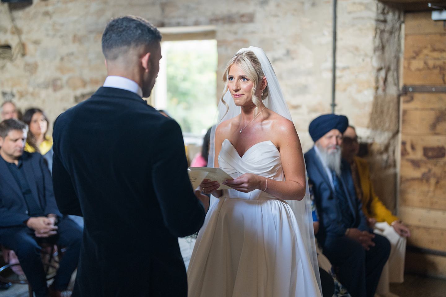 Exchanging wedding vows at Mia and Herman’s Healey Barn wedding