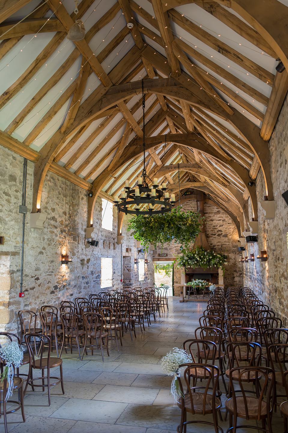 Stone barn ceremony setting at Mia and Herman’s Healey Barn wedding