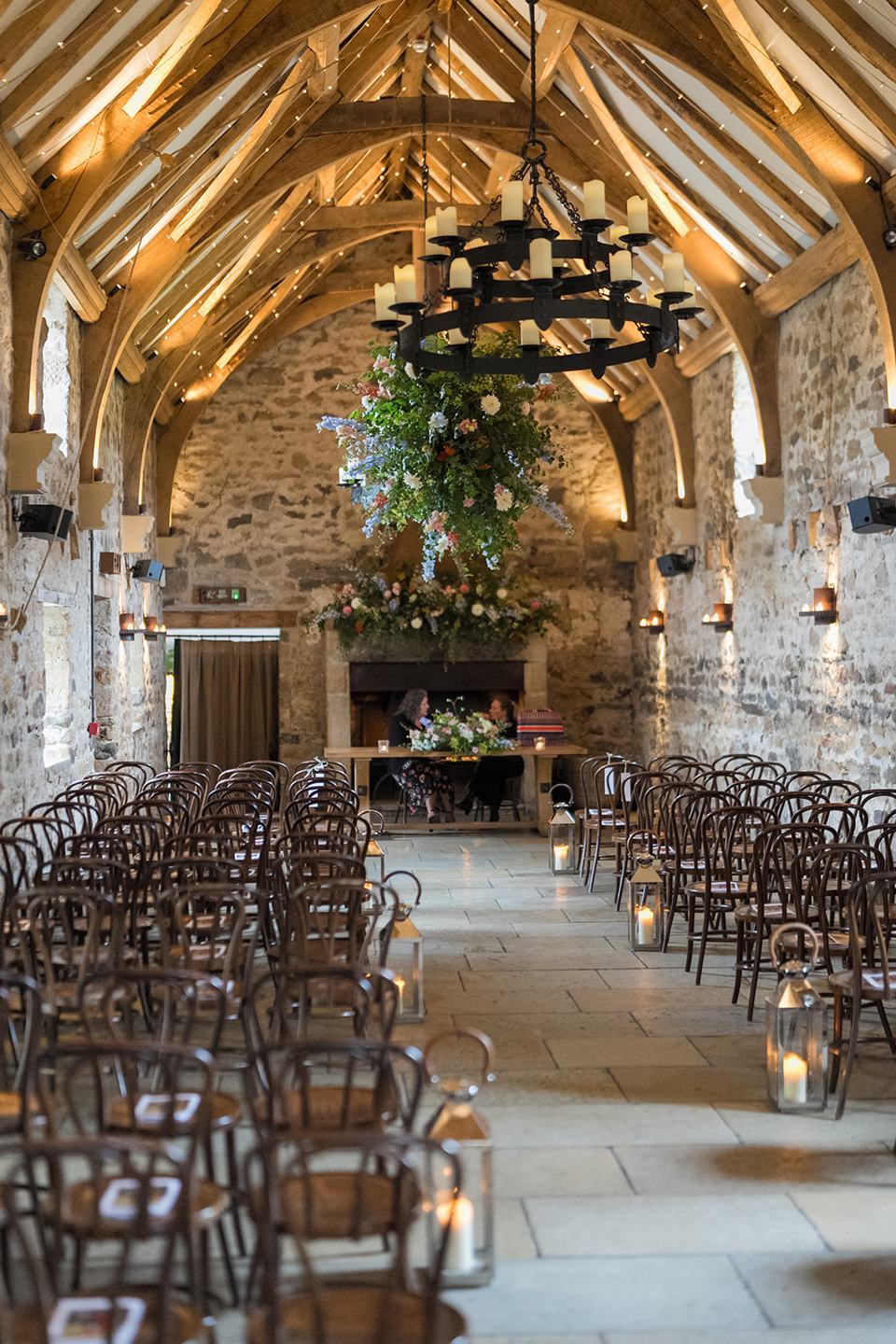The ceremony barn dressed with flowers at Sophie and Sam’s Healey Barn wedding