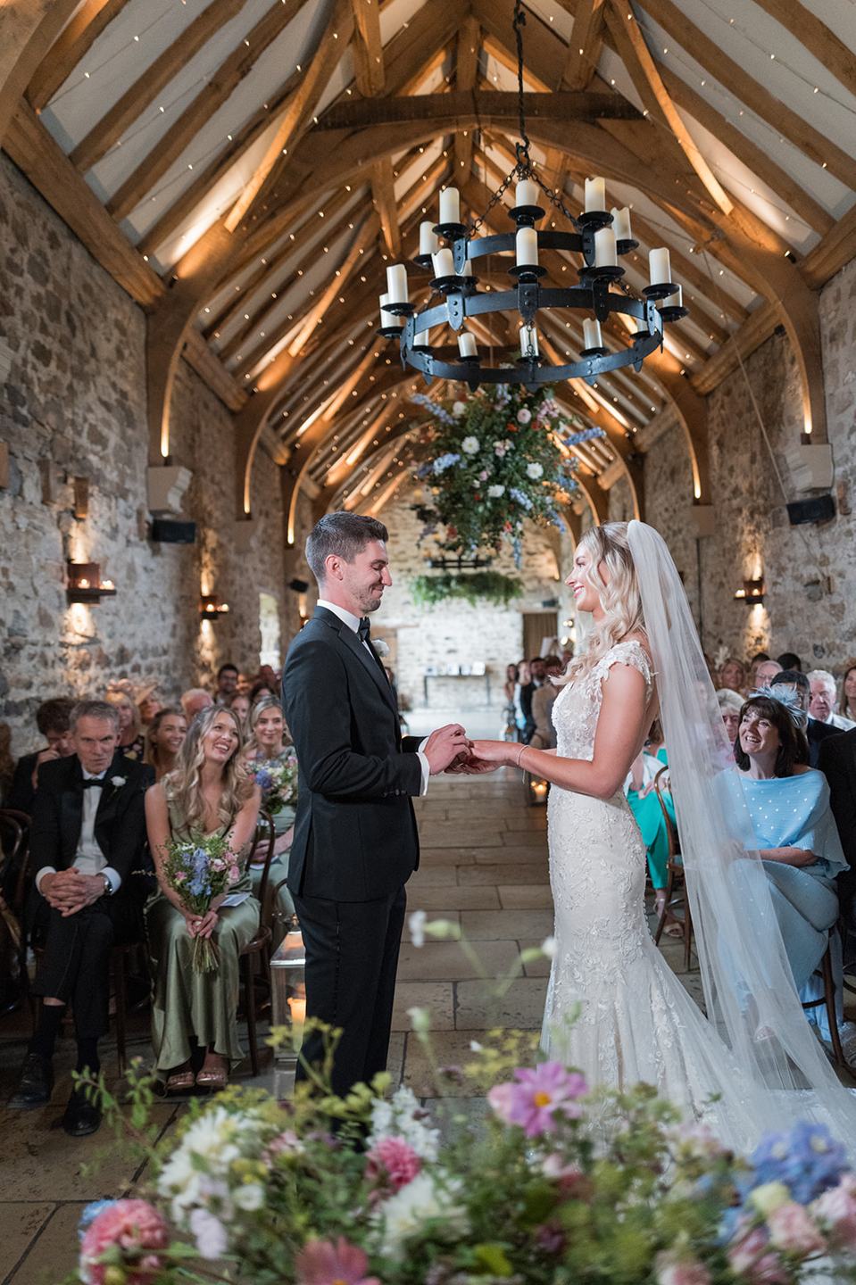 Exchanging vows at Sophie and Sam’s Healey Barn wedding