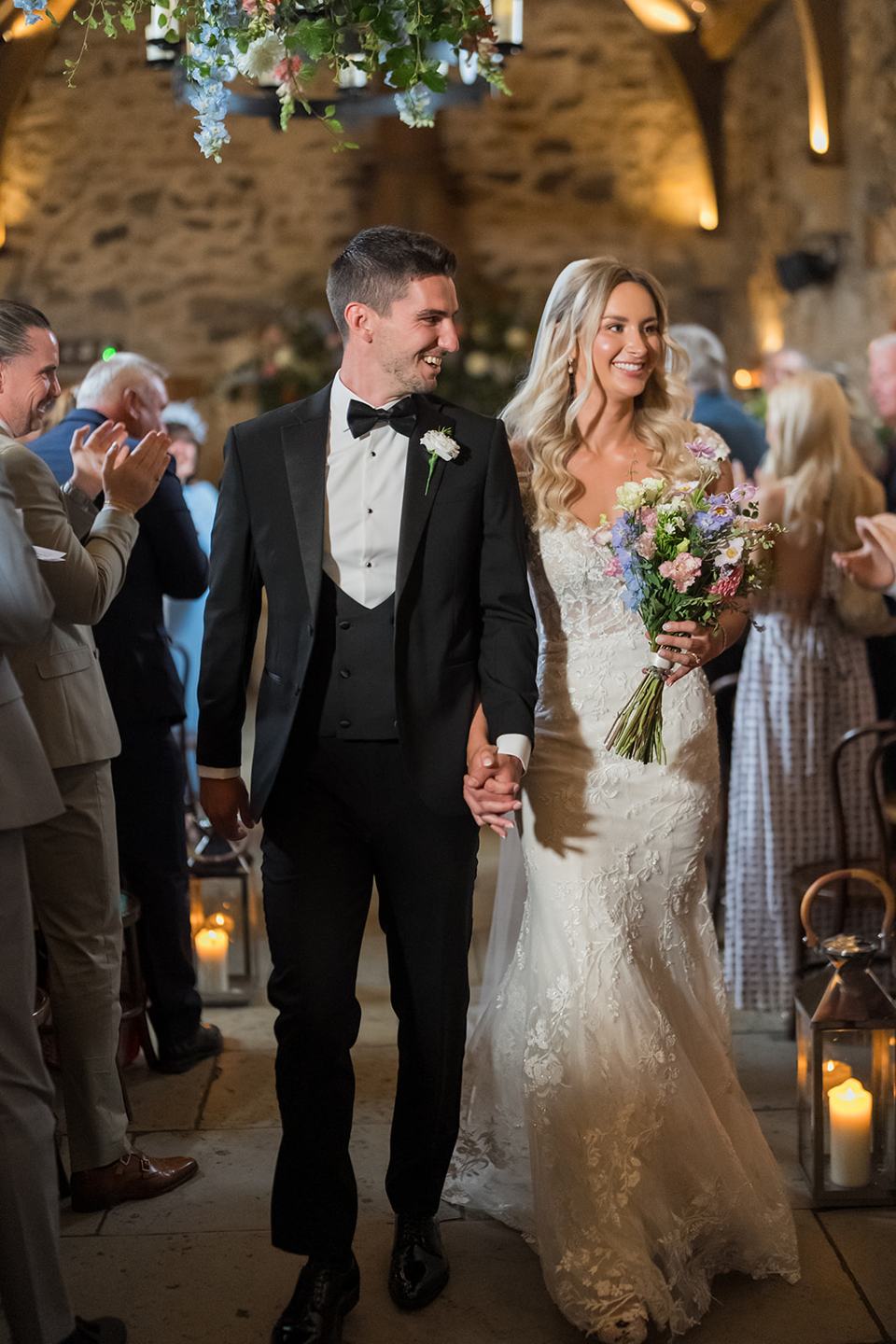 Walking down the aisle together at Sophie and Sam’s Healey Barn wedding