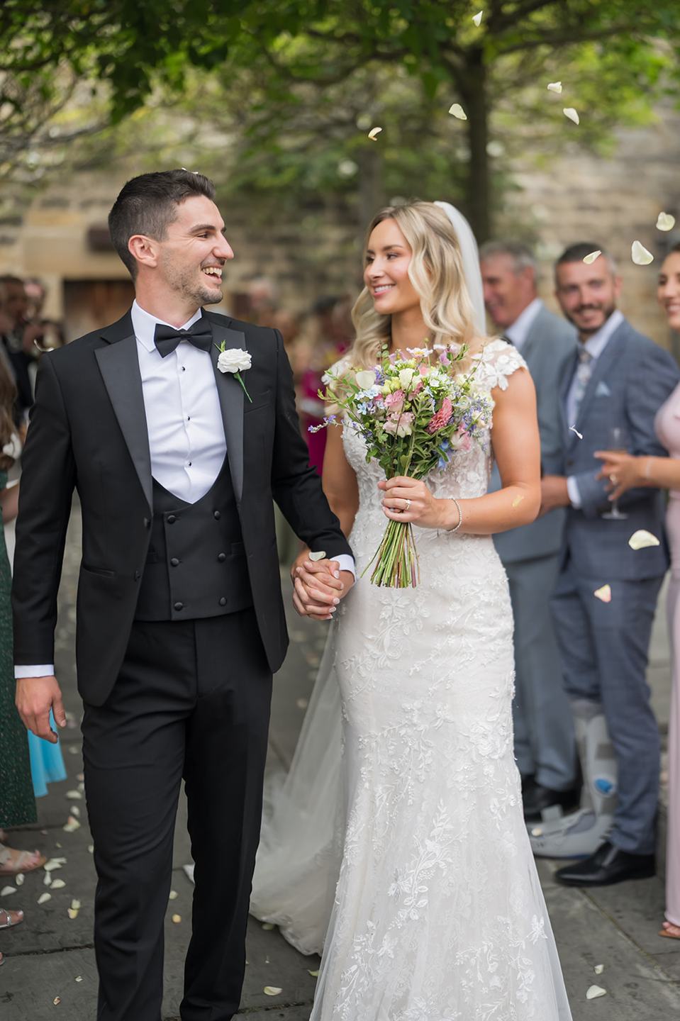 Confetti outside the barn at Sophie and Sam’s Healey Barn wedding