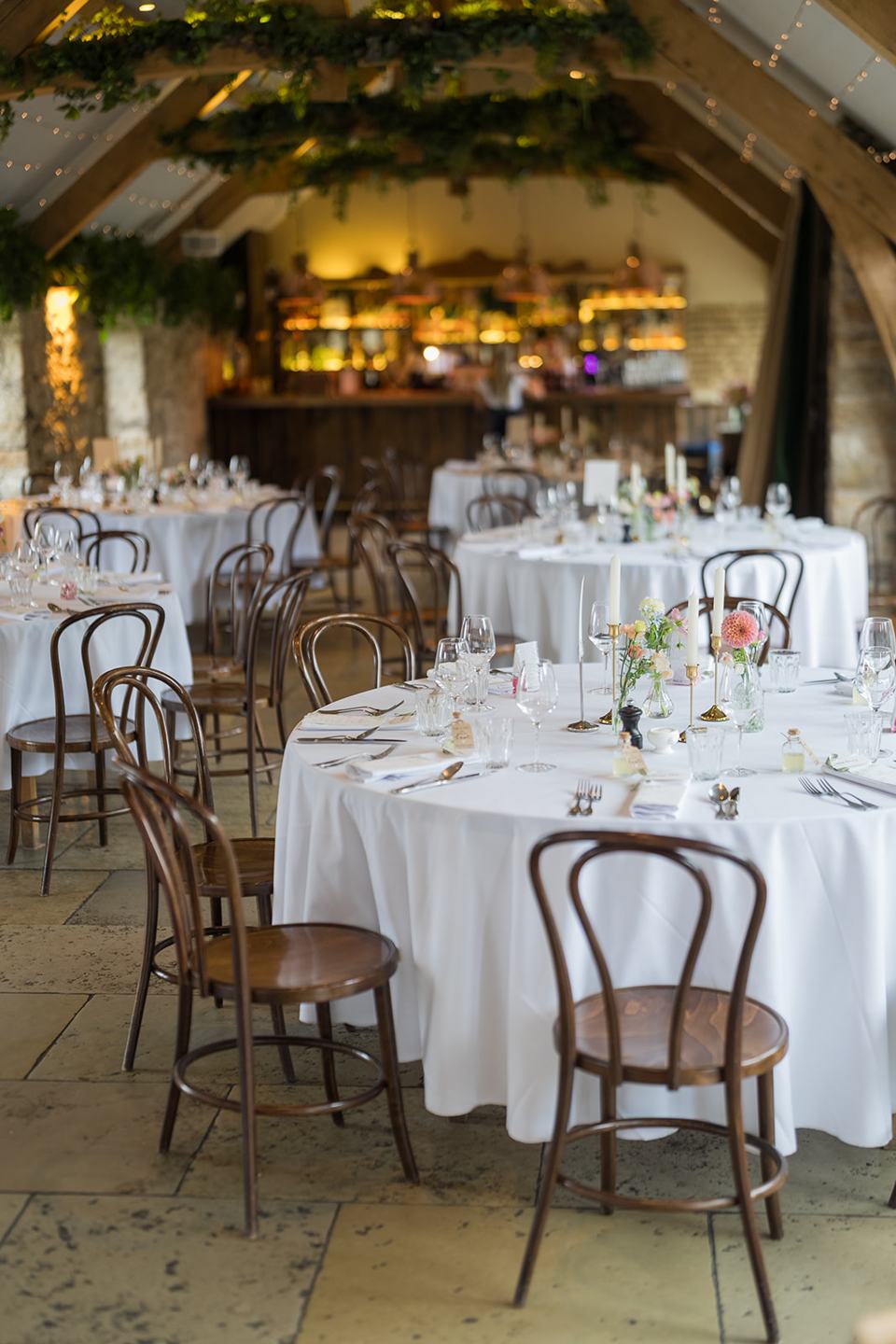 Wedding breakfast tables at Sophie and Sam’s Healey Barn wedding