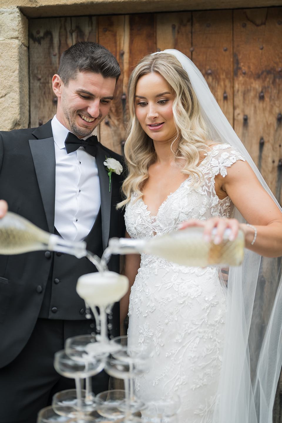Champagne tower celebration at Sophie and Sam’s Healey Barn wedding