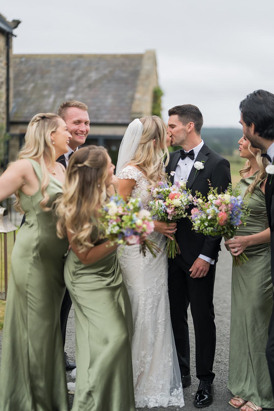 Wedding party laughing together at Sophie and Sam’s Healey Barn wedding