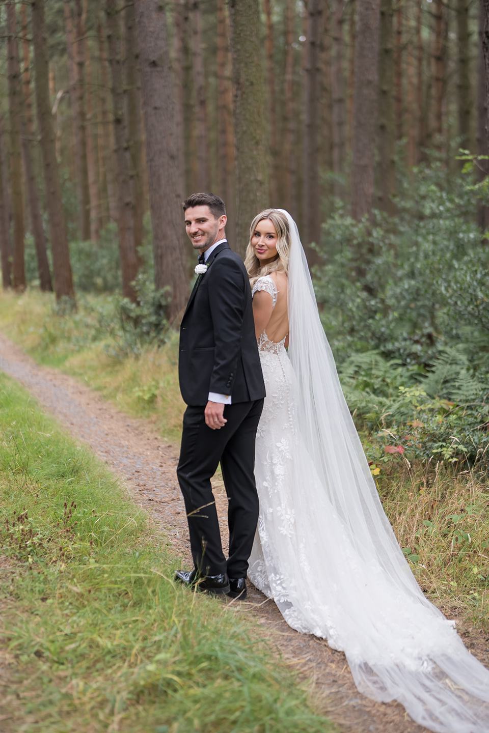 Newlyweds in the woodland at Sophie and Sam’s Healey Barn wedding