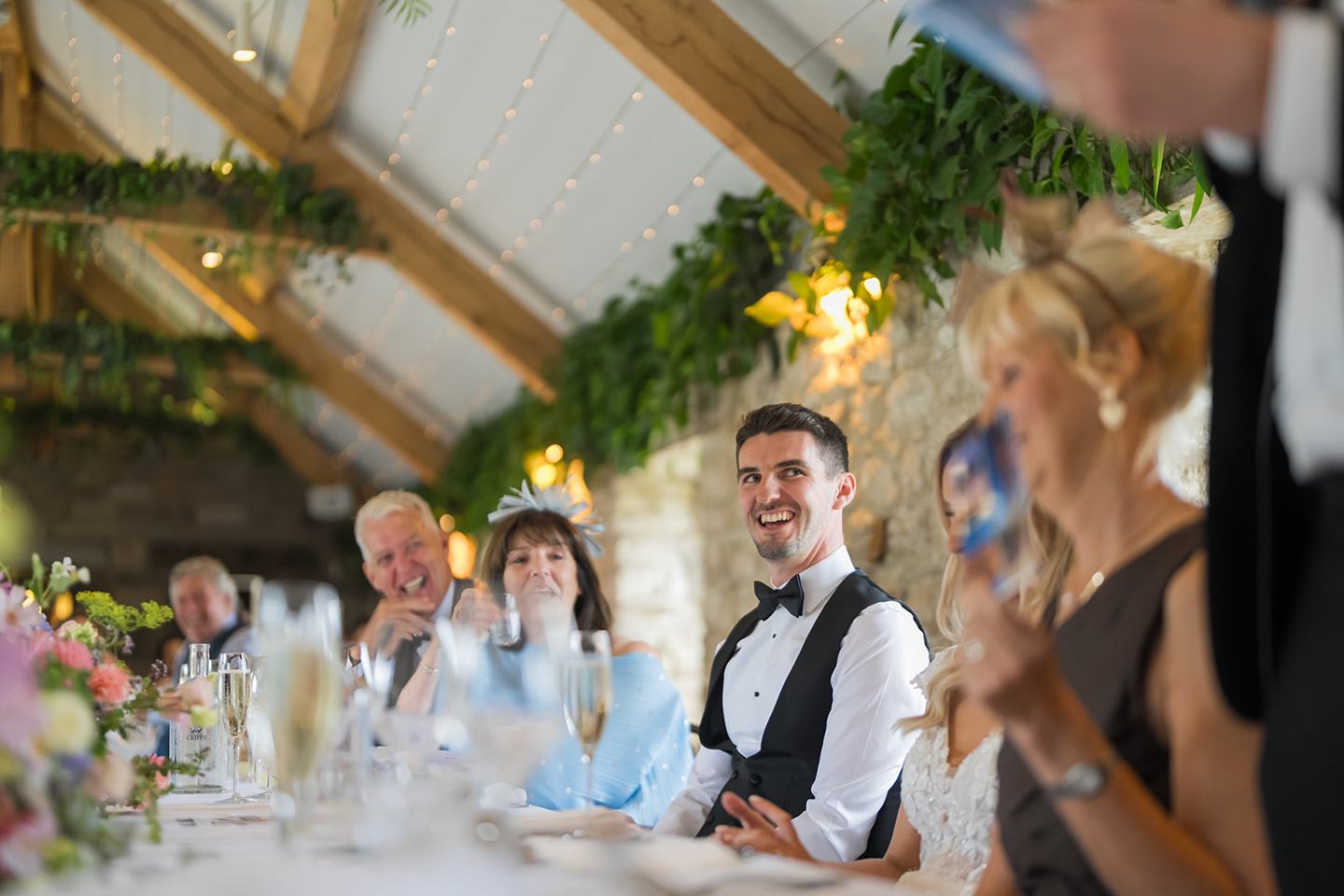Laughter during speeches at Sophie and Sam’s Healey Barn wedding