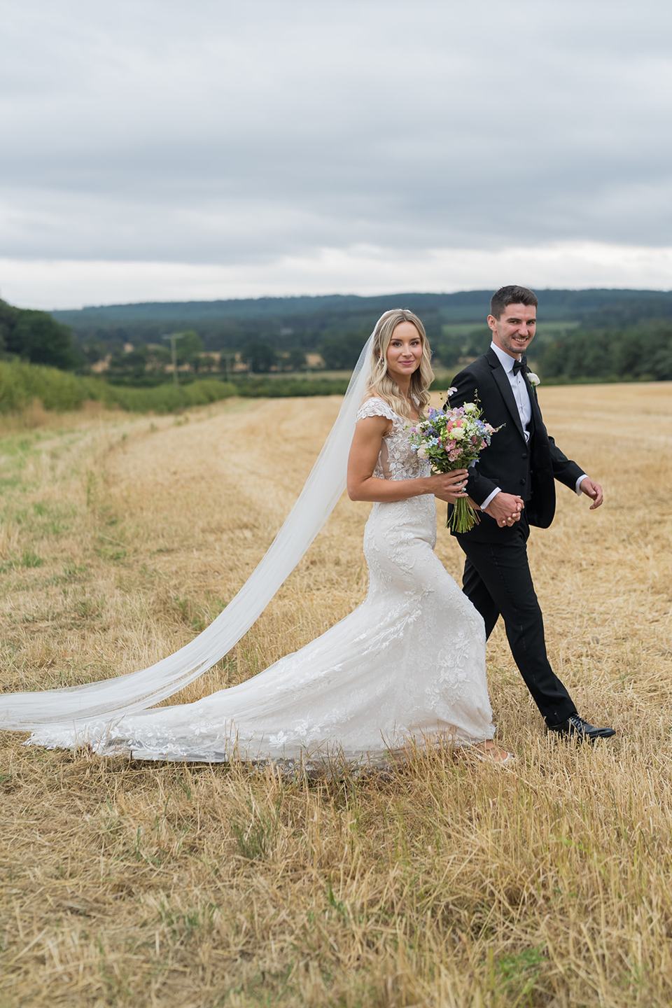 Portrait in the meadow at Sophie and Sam’s Healey Barn wedding