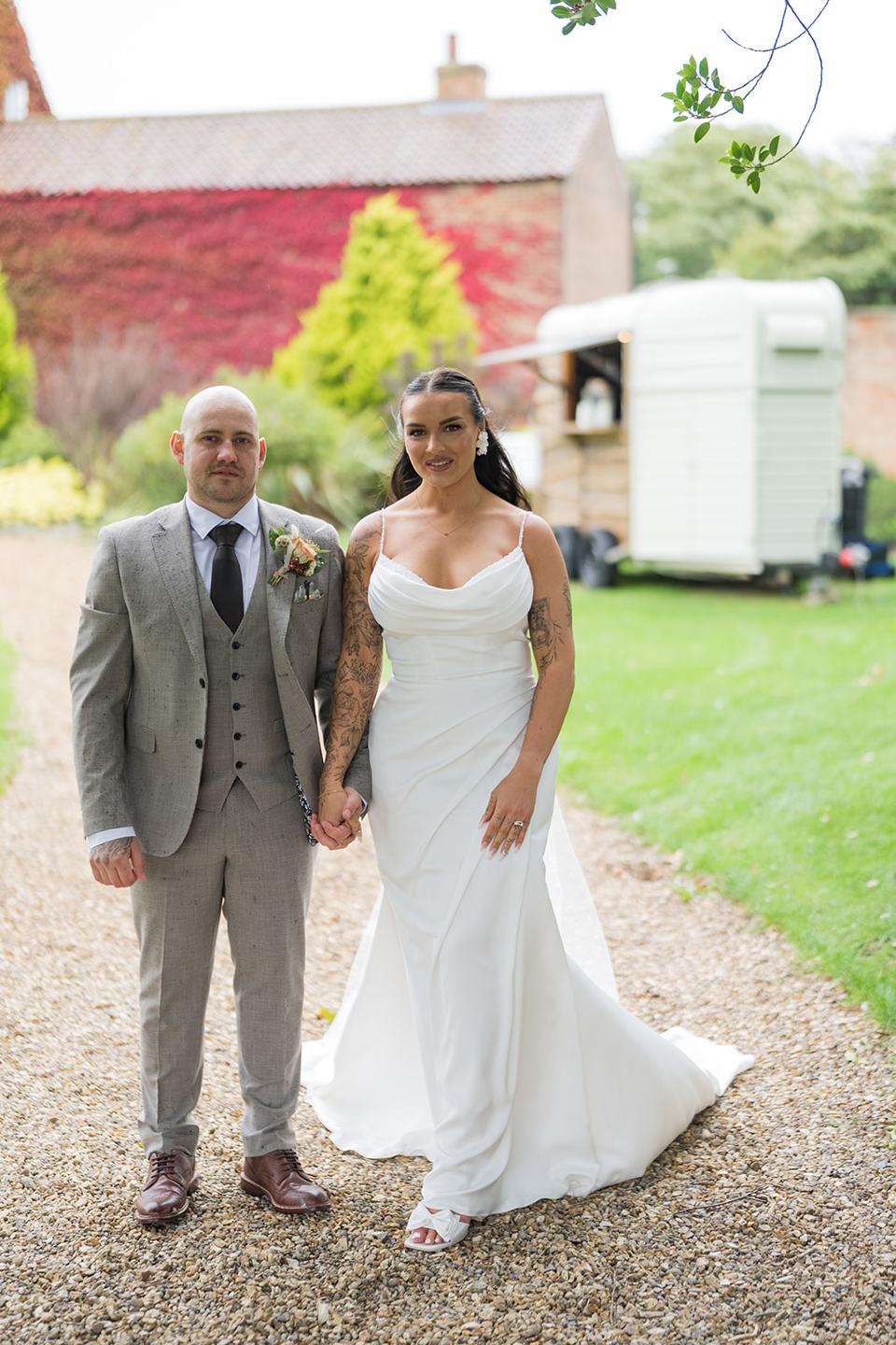 Couple in the manor grounds at Sally and Callum’s Hornington Manor wedding