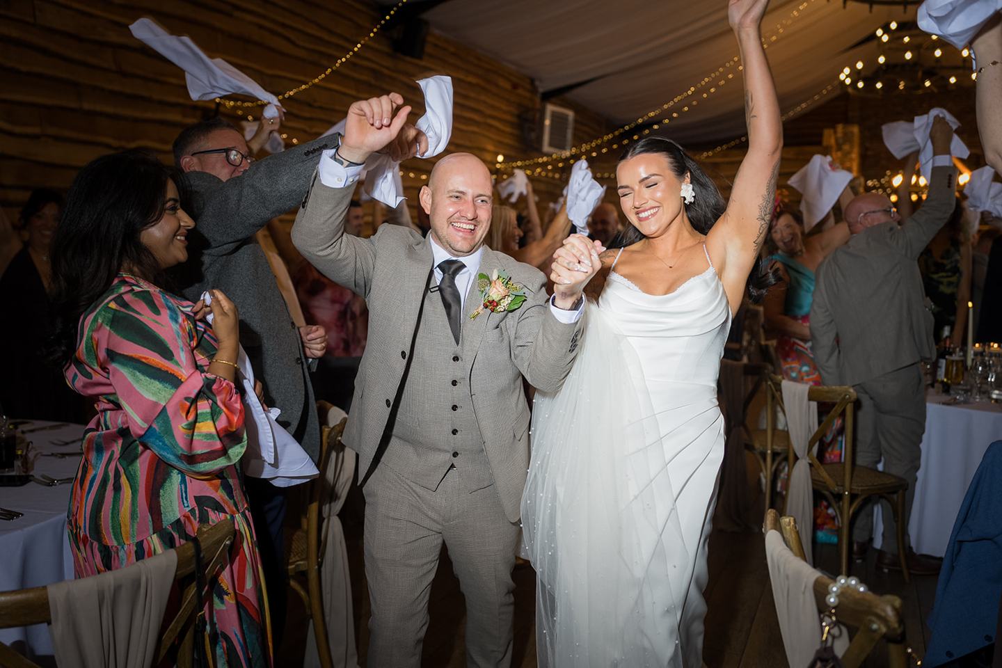Couple entering the wedding breakfast at Sally and Callum’s Hornington Manor wedding