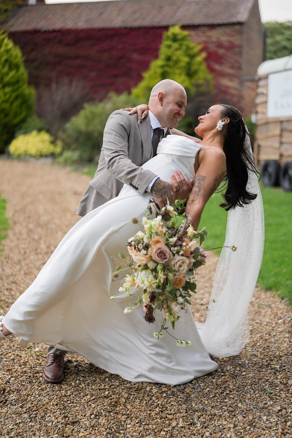 Couple portrait in front of the manor at Sally and Callum’s Hornington Manor wedding