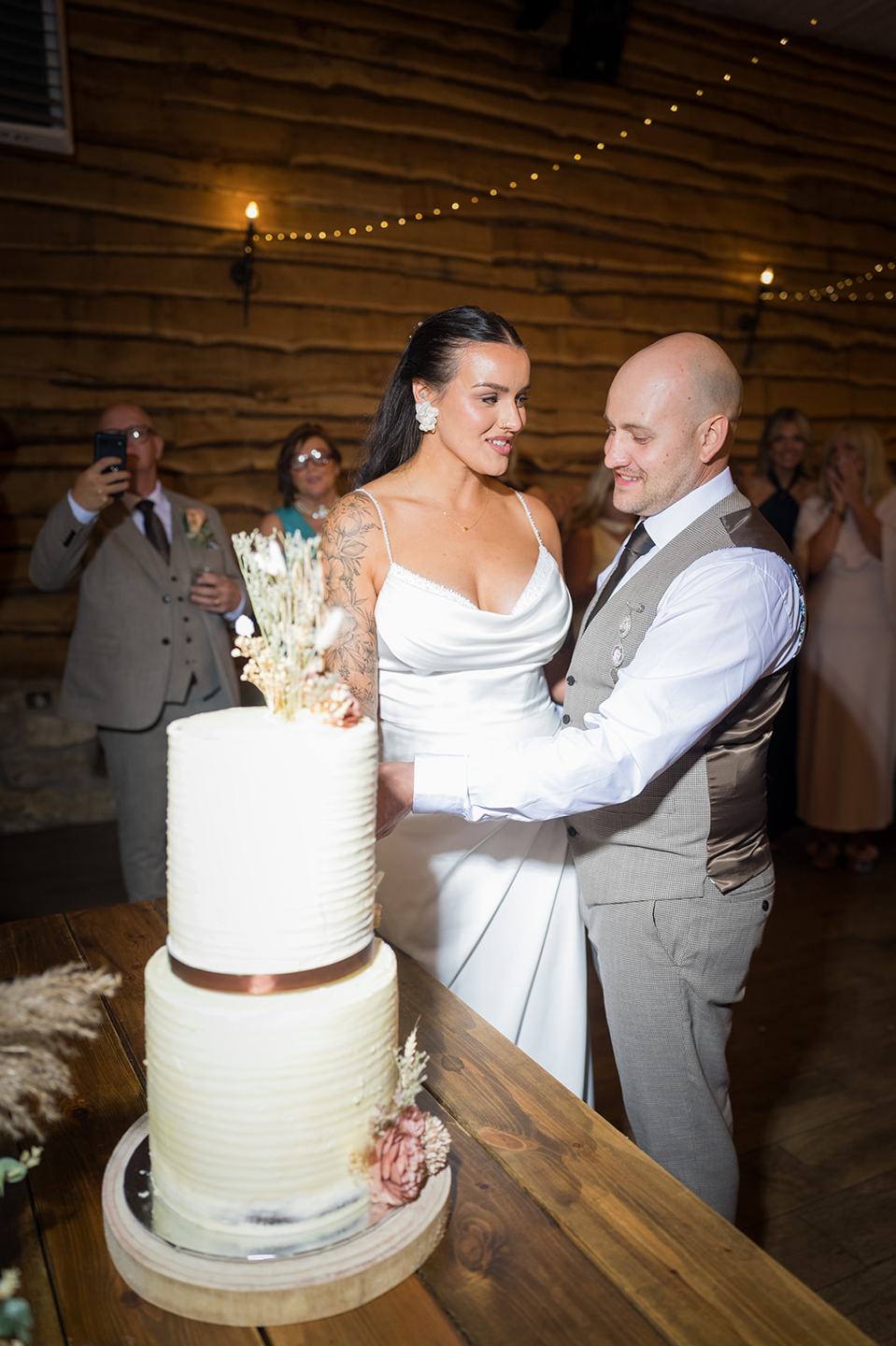 Cutting the wedding cake at Sally and Callum’s Hornington Manor wedding